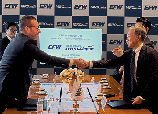 Left: Jordi Boto, EFW CEO and right: Takashi Takahashi, CEO, MJP shake hands after signing a contract to partner for A320P2F/A321P2F conversions. EFW image.