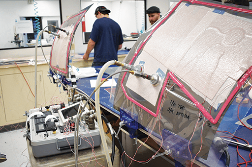 Bag (a vacuum bag) and bonder (a hot bonder device) are components of a hot bonding process, where the vacuum bag seals the repair area, and the hot bonder applies precise heat and vacuum to cure adhesive or resin, ensuring proper compaction, bond strength and restoration of structural integrity to the composite structure. Abaris image.