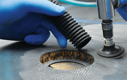 The taper scarf repair technique for composite structures is where a tapered cavity is machined into the damaged area, replacing the damaged material and providing a large, gradual surface area for bonding a new patch. This technique creates a joint with uniform shear properties, restoring the damaged composite structure to its designed strength and avoiding the need for external, bolted patches. Abaris image.